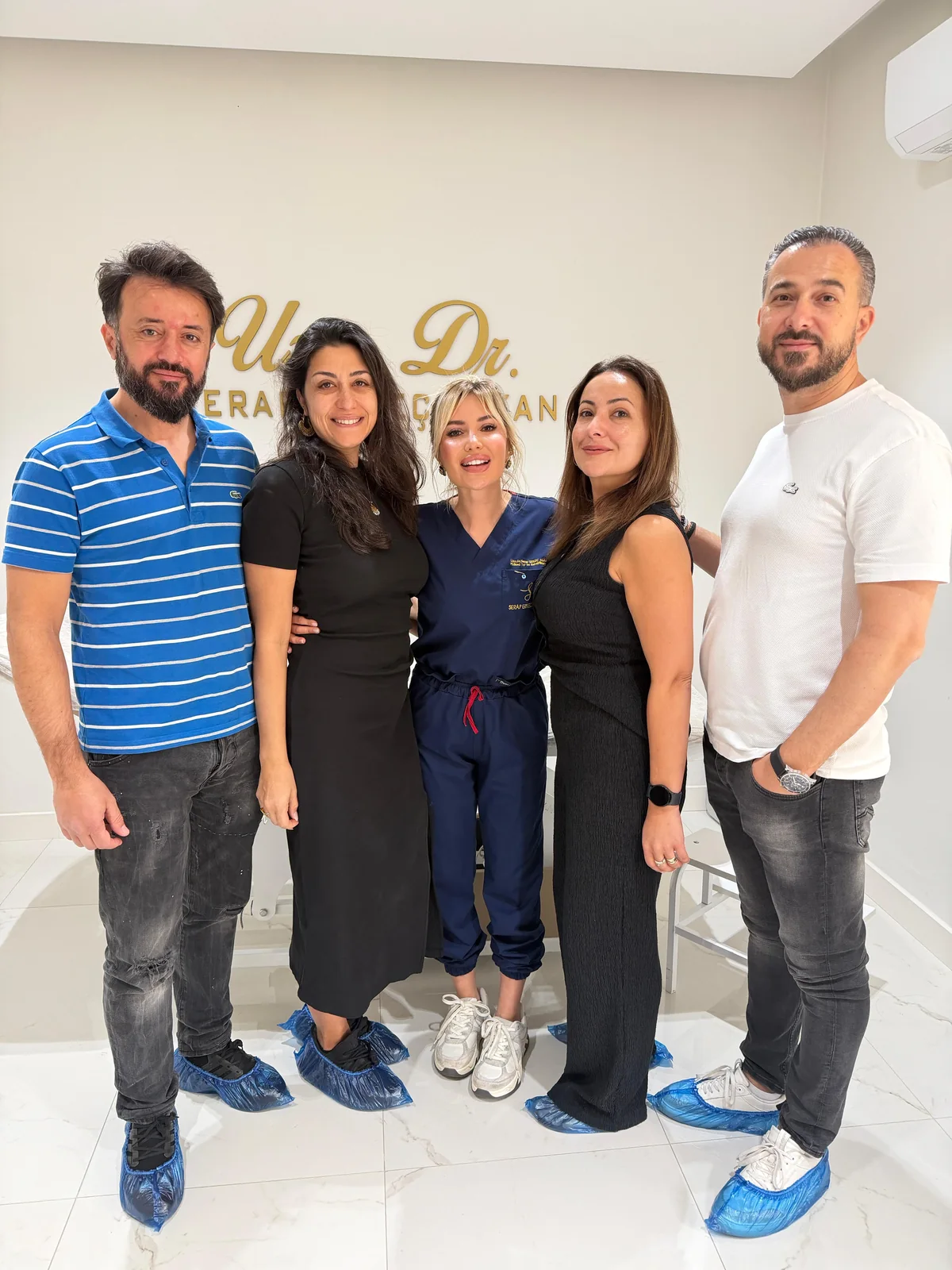 Dr. Serap Erkeç Alkan with visitors at her clinic